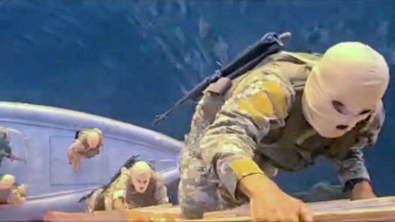 Soldiers take part in the seizure of the container ships MSC Francesca and Epaminondas in the Strait of Hormuz, according to footage broadcast on Iranian state TV and released on April 22, 2026.
