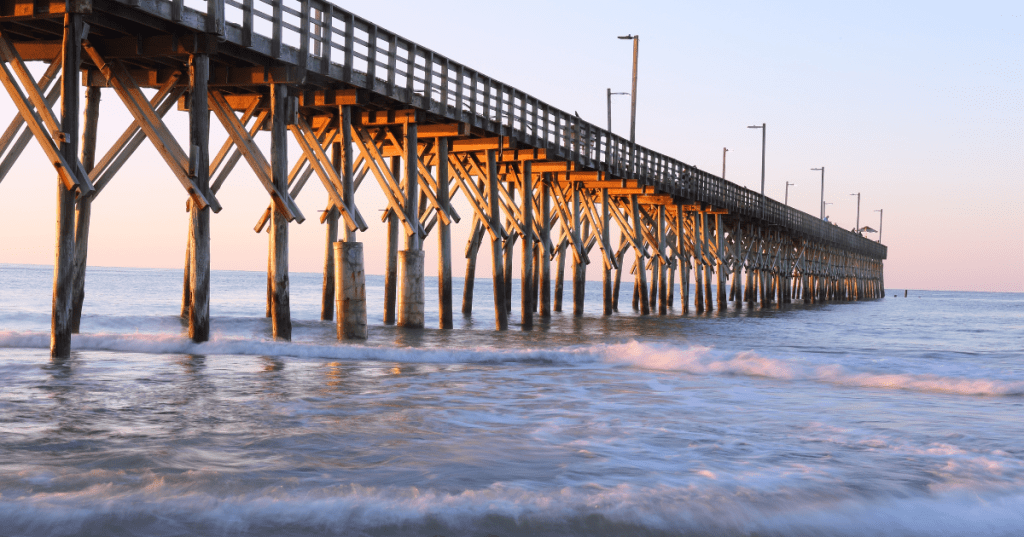 A fishing pier in Surf City, North Carolina on a summer morning.