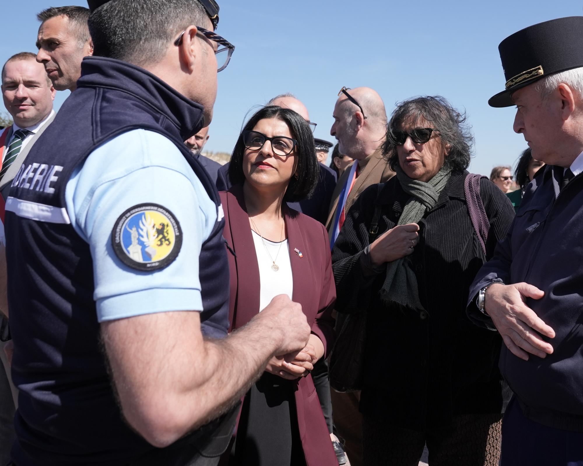 Shabana Mahmood speaking to a gendarme at Zuydcoote beach, France, where she signed a deal with her French counterpart to try to stop migrants crossing the Channel. Photograph: Stefan Rousseau/PA