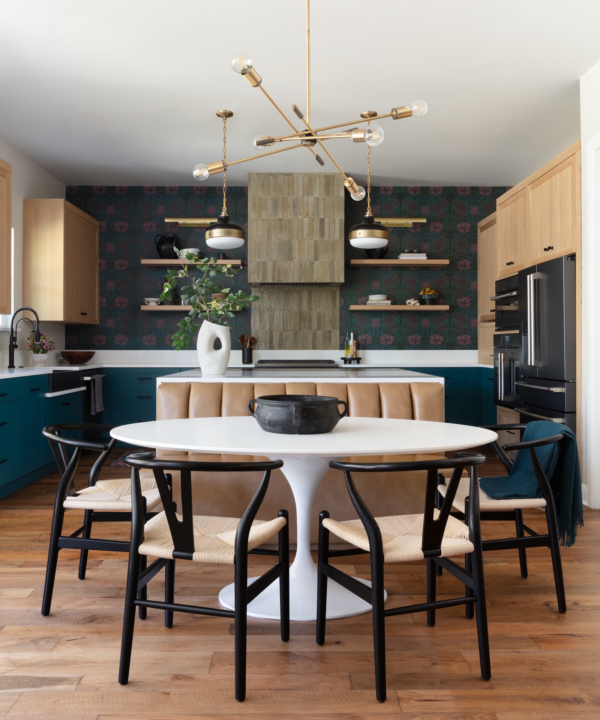 kitchen with island with banquette seat and white round table