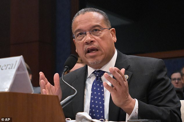 Minnesota's Democrat AG uses his phone while sat on stage as woman in ...