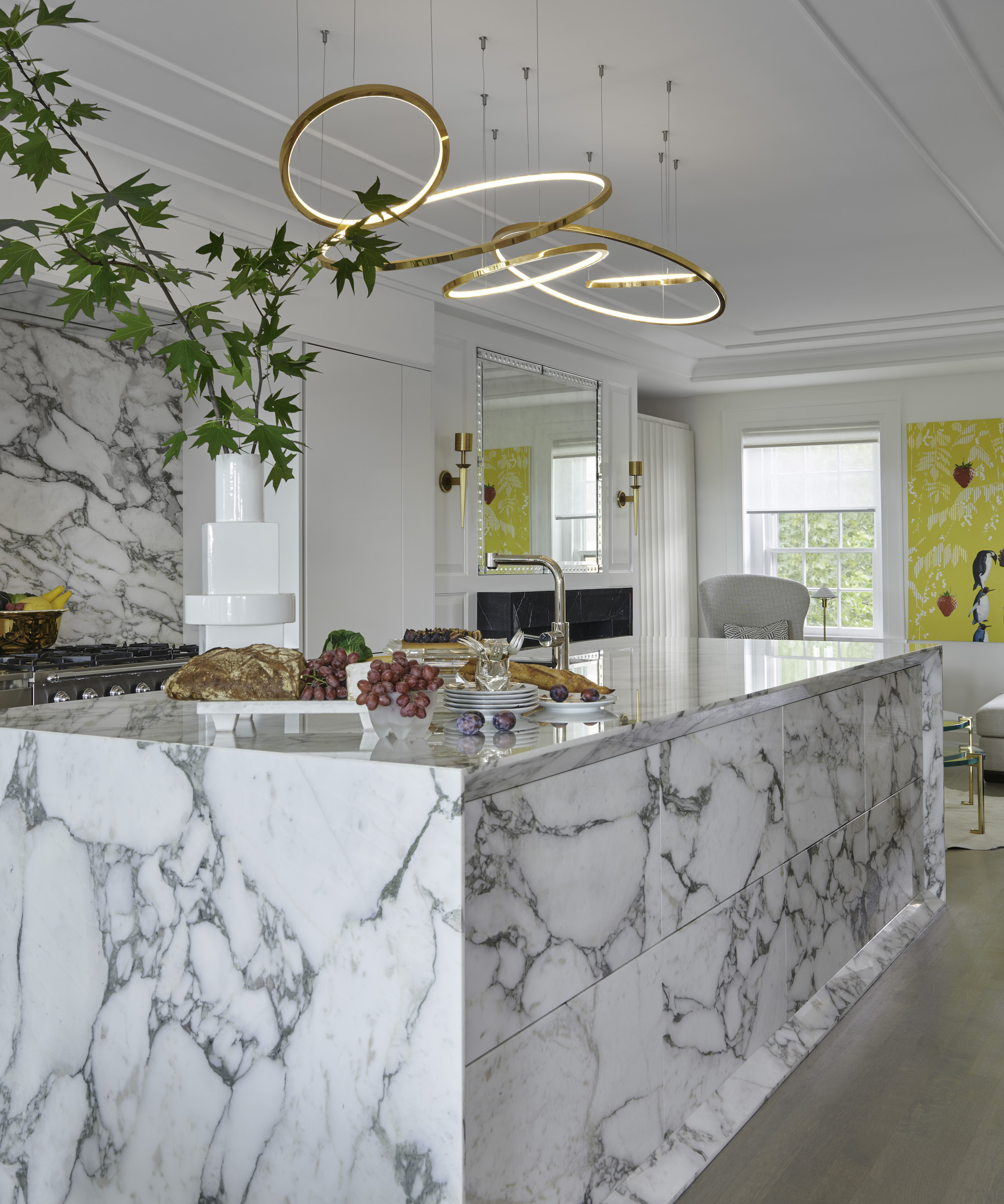 kitchen with marble island and fancy lighting above