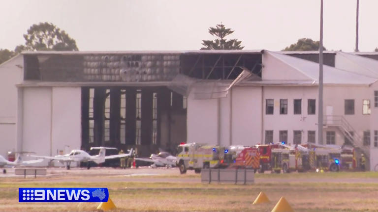 The fire has significantly damaged the hangar and several planes inside.