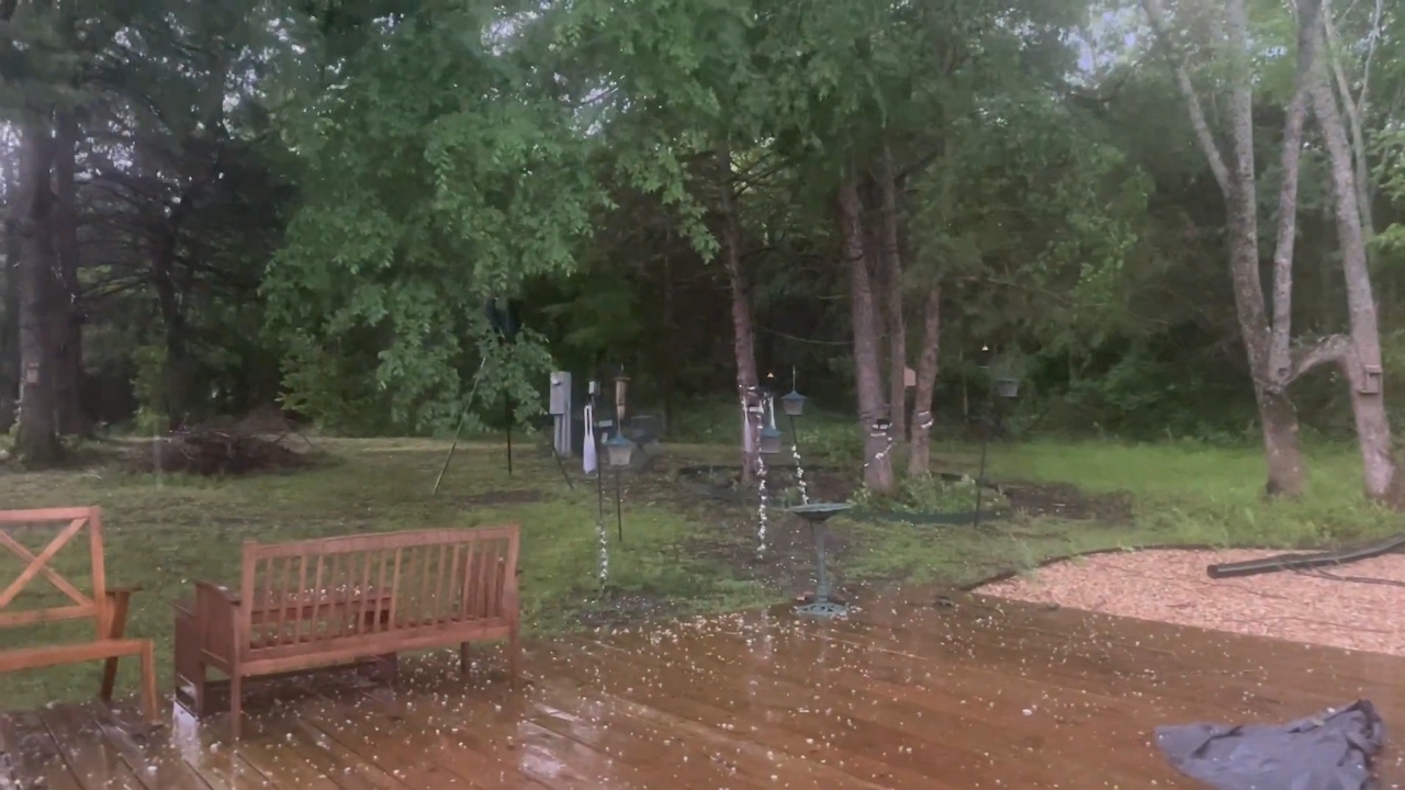 Hail blankets a wooden deck in Arkansas storm