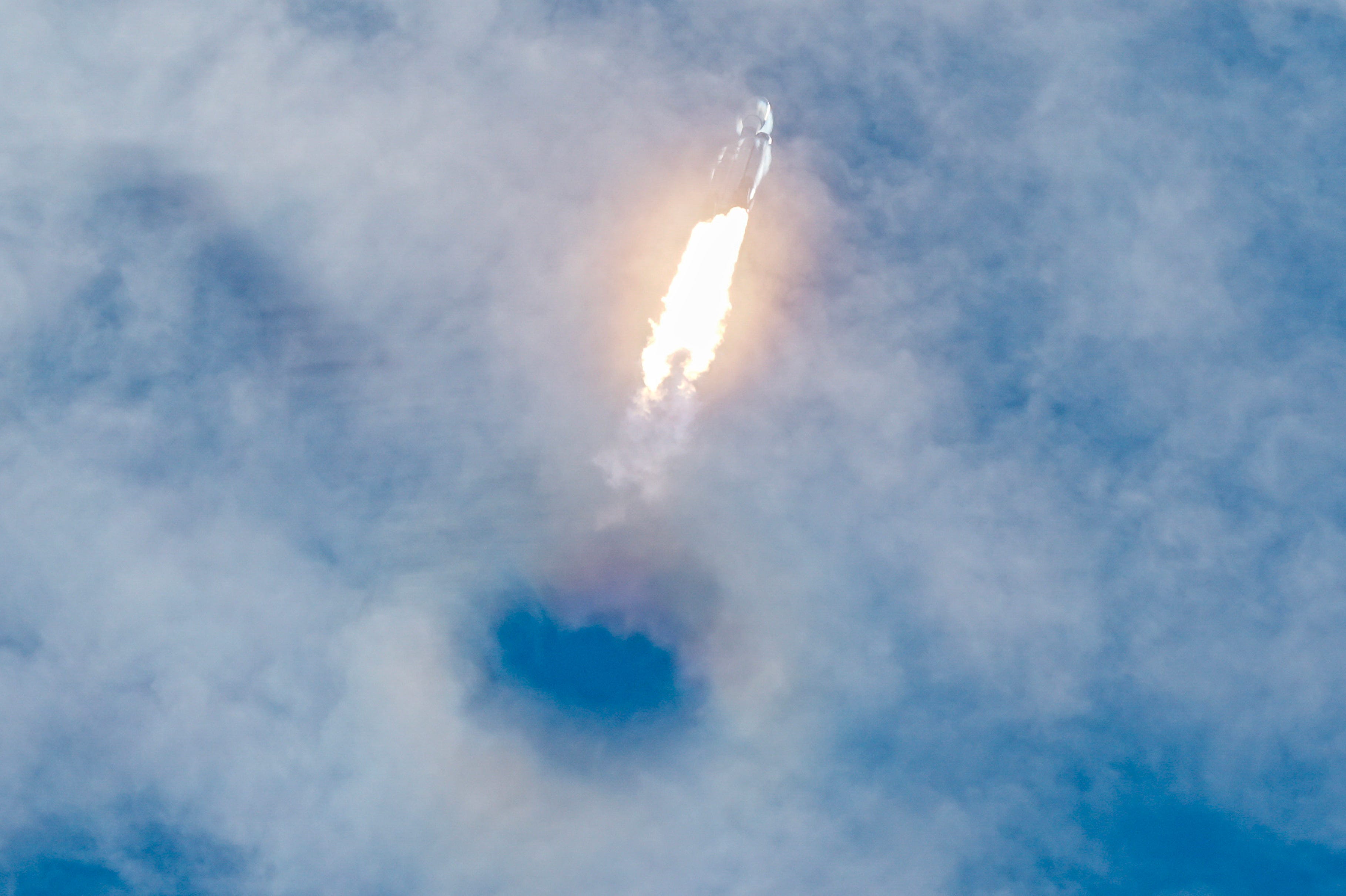 Falcon Heavy powers its way through clouds in photo of the week