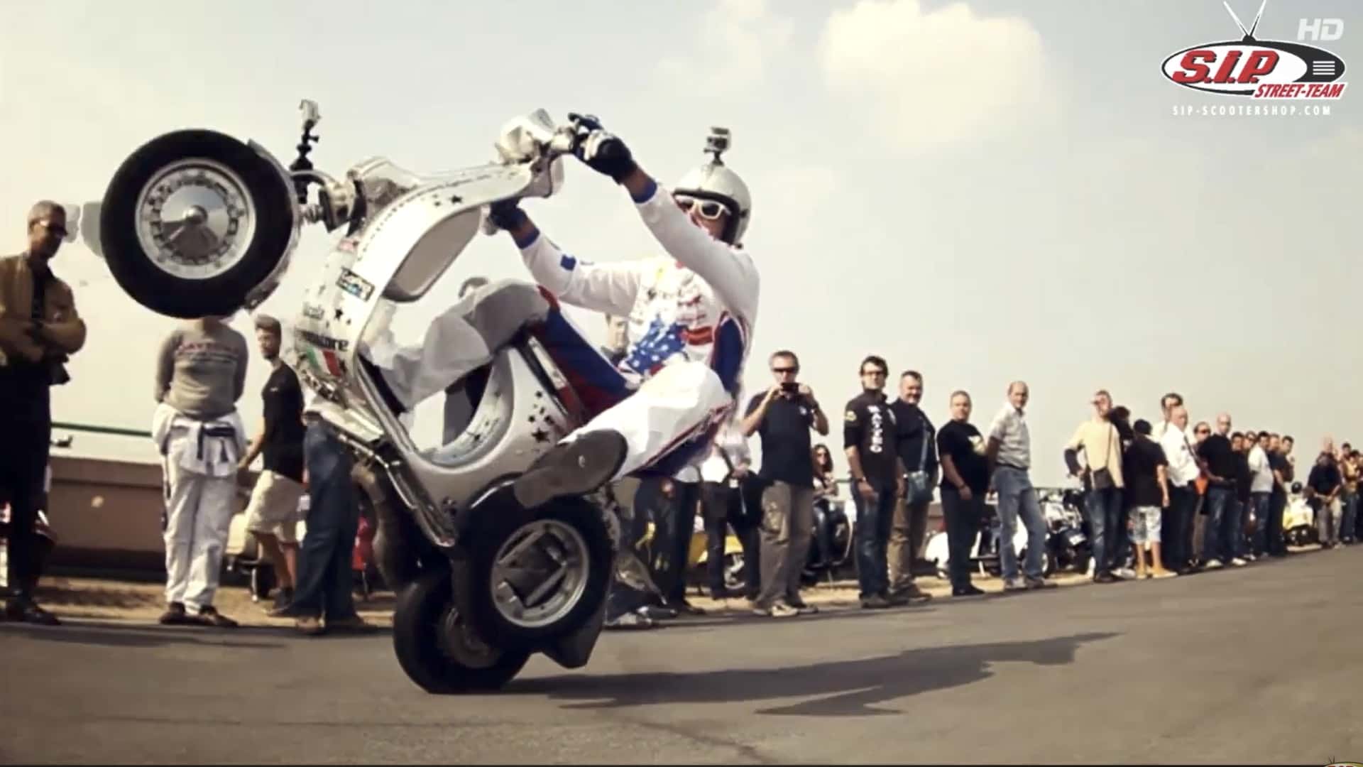 A bunch of Vespa scooters once raced on a rooftop race track, and it's ...
