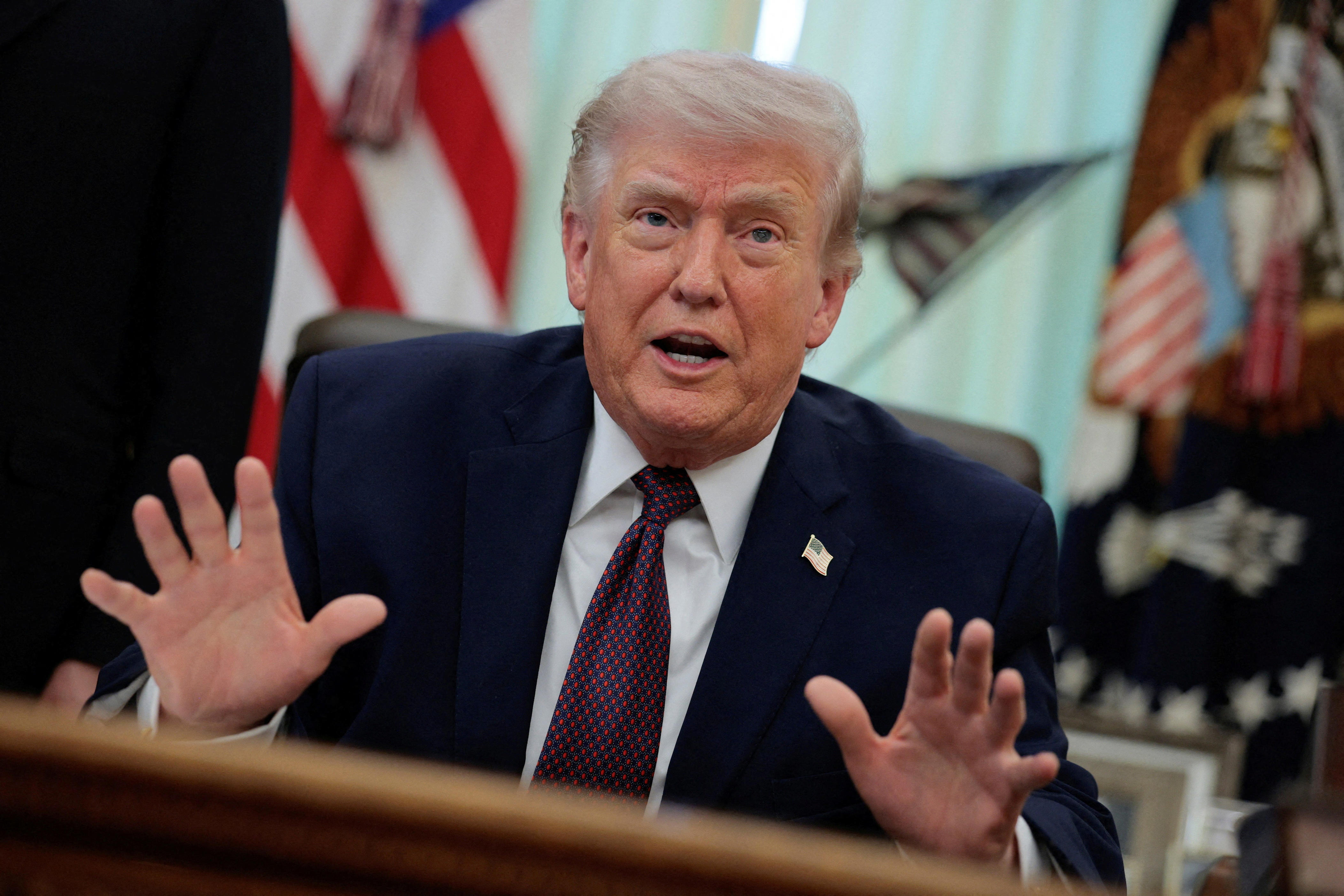 President Donald Trump speaks during the signing ceremony for an executive order on mail ballots, in the Oval Office of the White House in Washington, D.C., March 31, 2026.