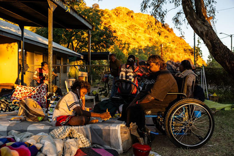 The five-year-old’s family outside the property she was taken from on Marshall Street on Saturday.