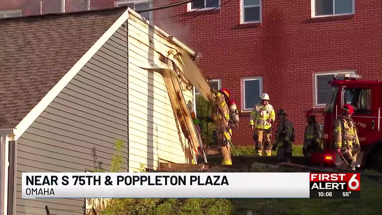 Omaha crews battle fire that spread to several garages
