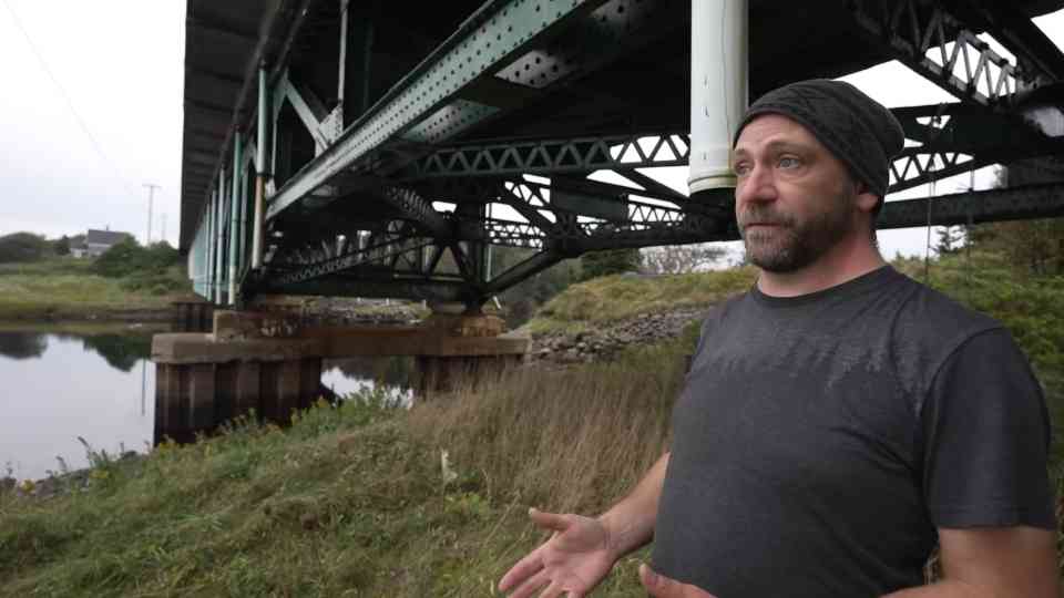 He was dropped off at a bridge - then spent the night hanging beneath it