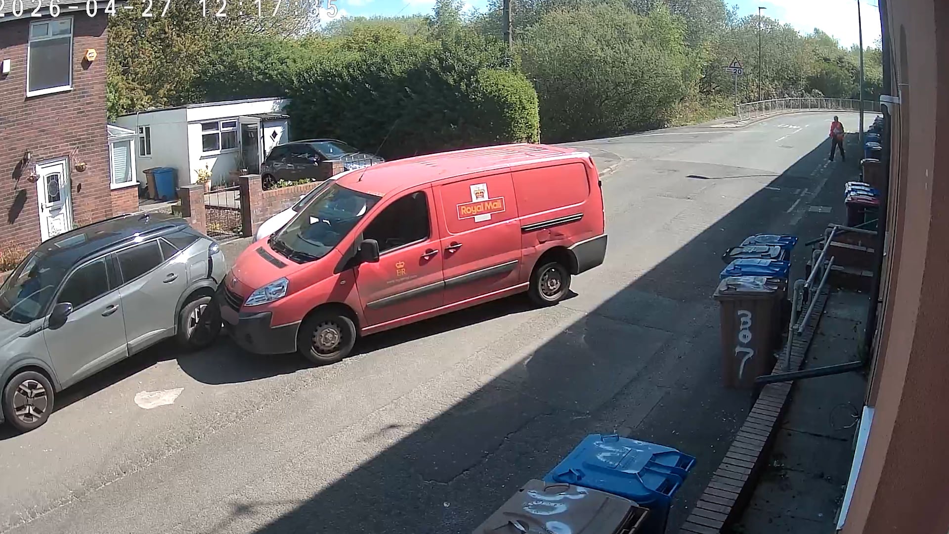 Postman’s van rolls away and smashes into parked car after handbrake fail