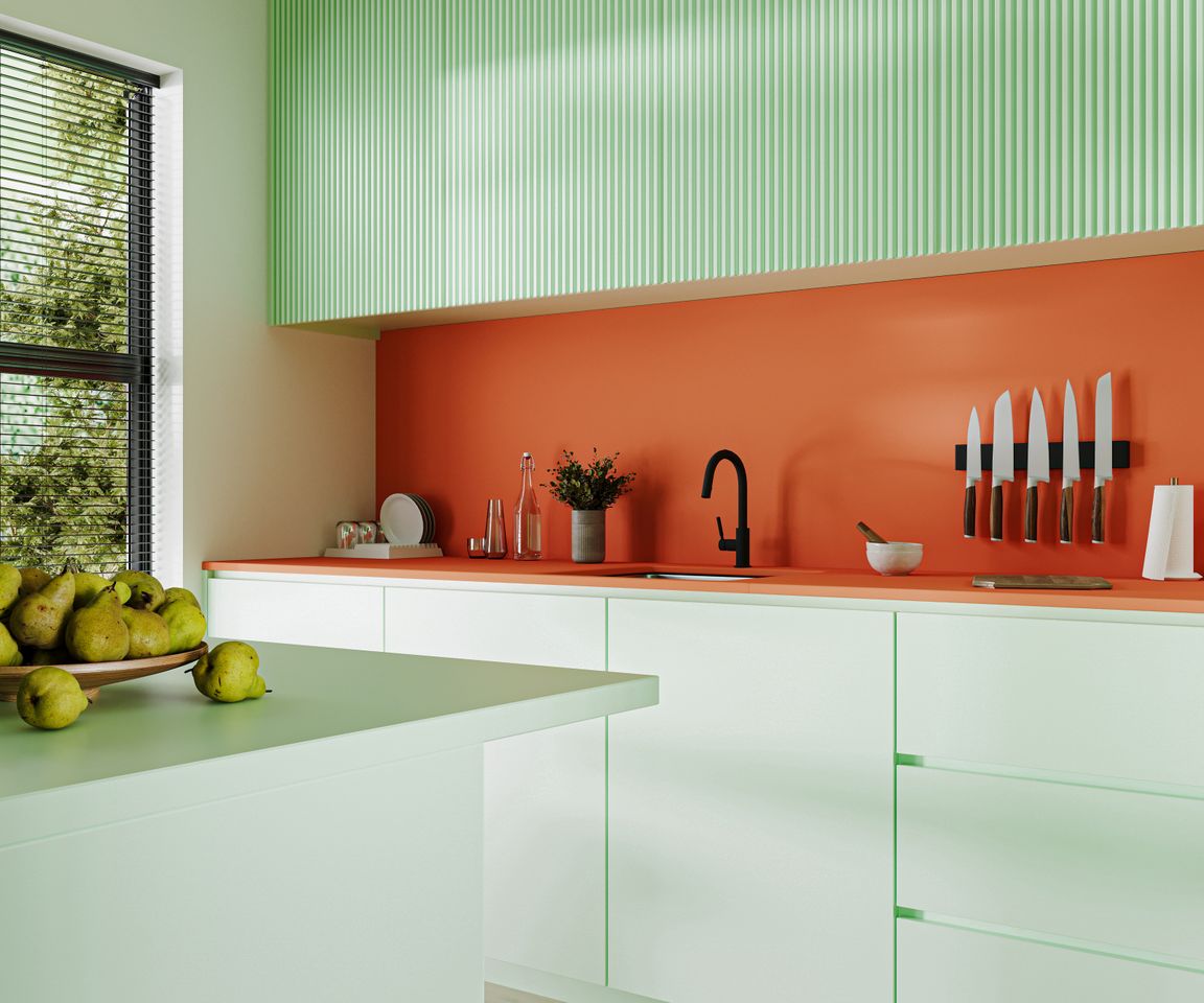 Modern kitchen interior with bright coloured cabinets,