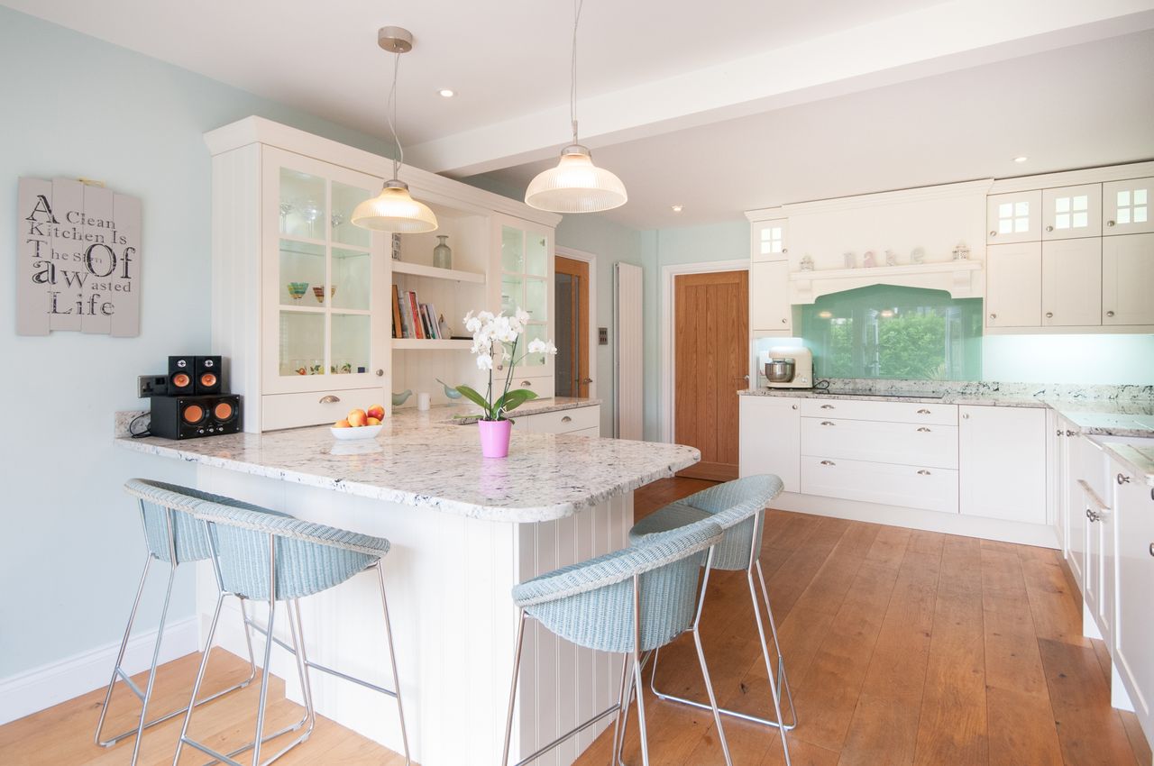 White shaker kitchen with pastel powder-blue hues