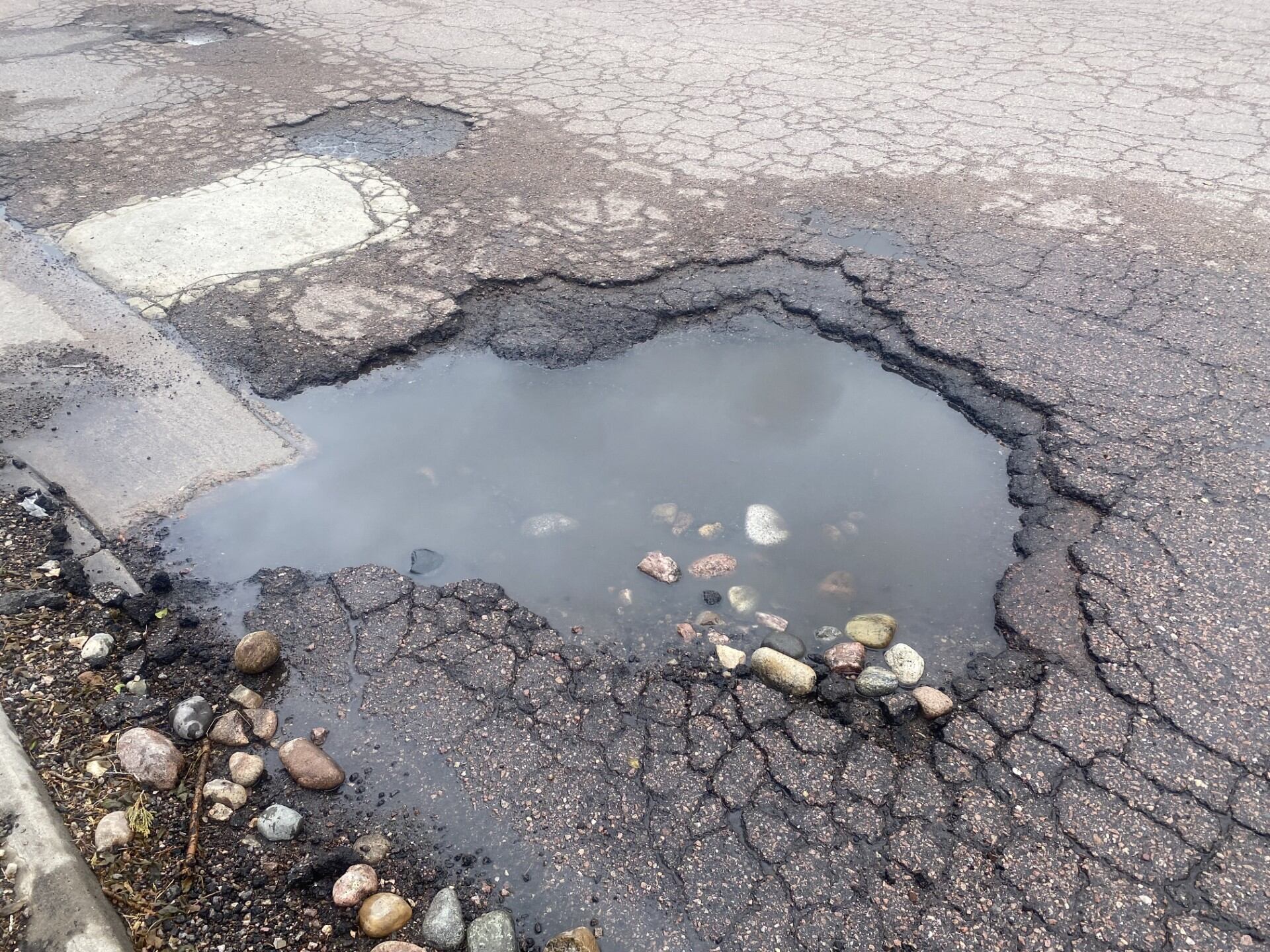 Driver reports damage from pothole at Colorado Springs shopping center ...
