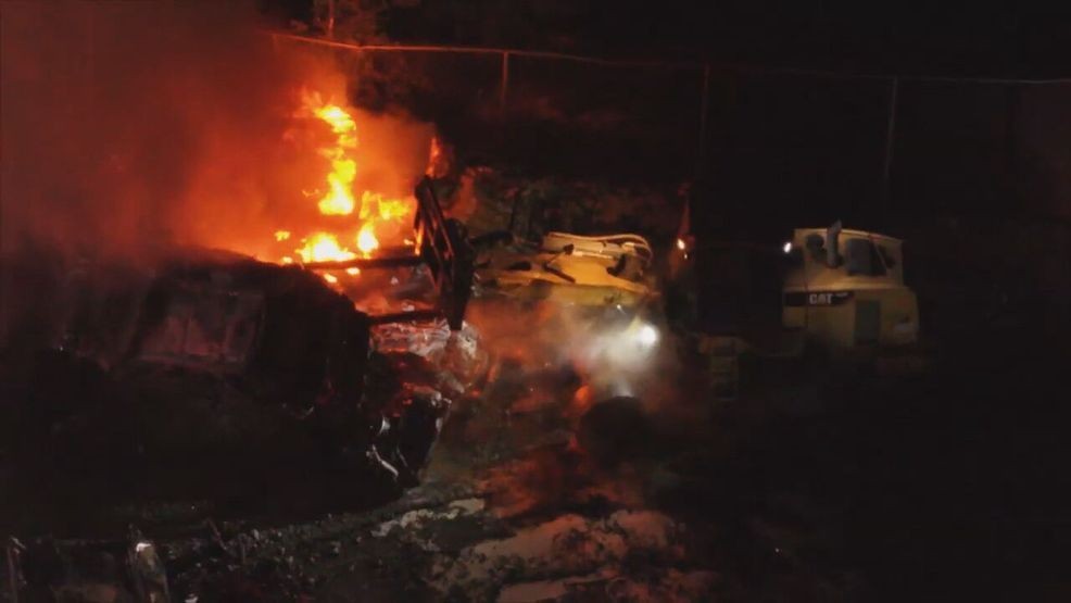 Crews battle overnight fire at Graham wrecking yard for hours