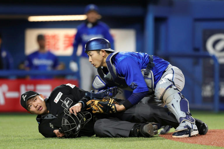 Japan baseball umpire hit by bat still unconscious two weeks on