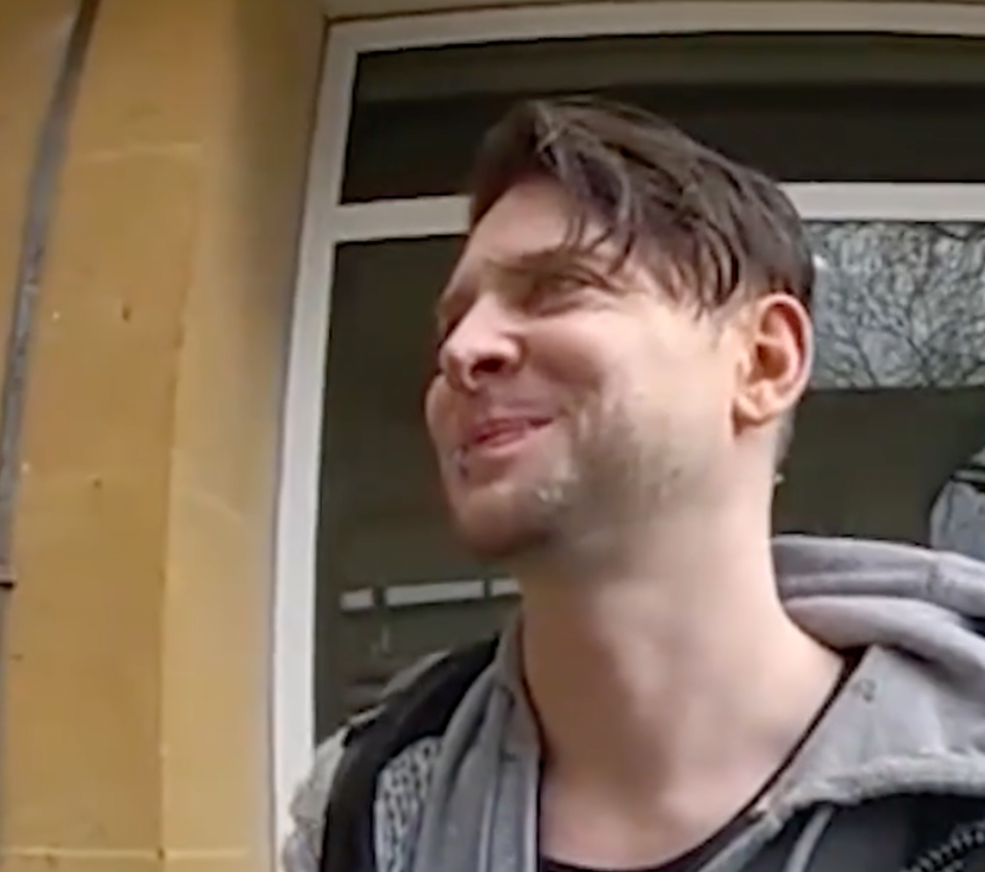Famed '80s new wave band's singer smirks as he's arrested on horrifying ...