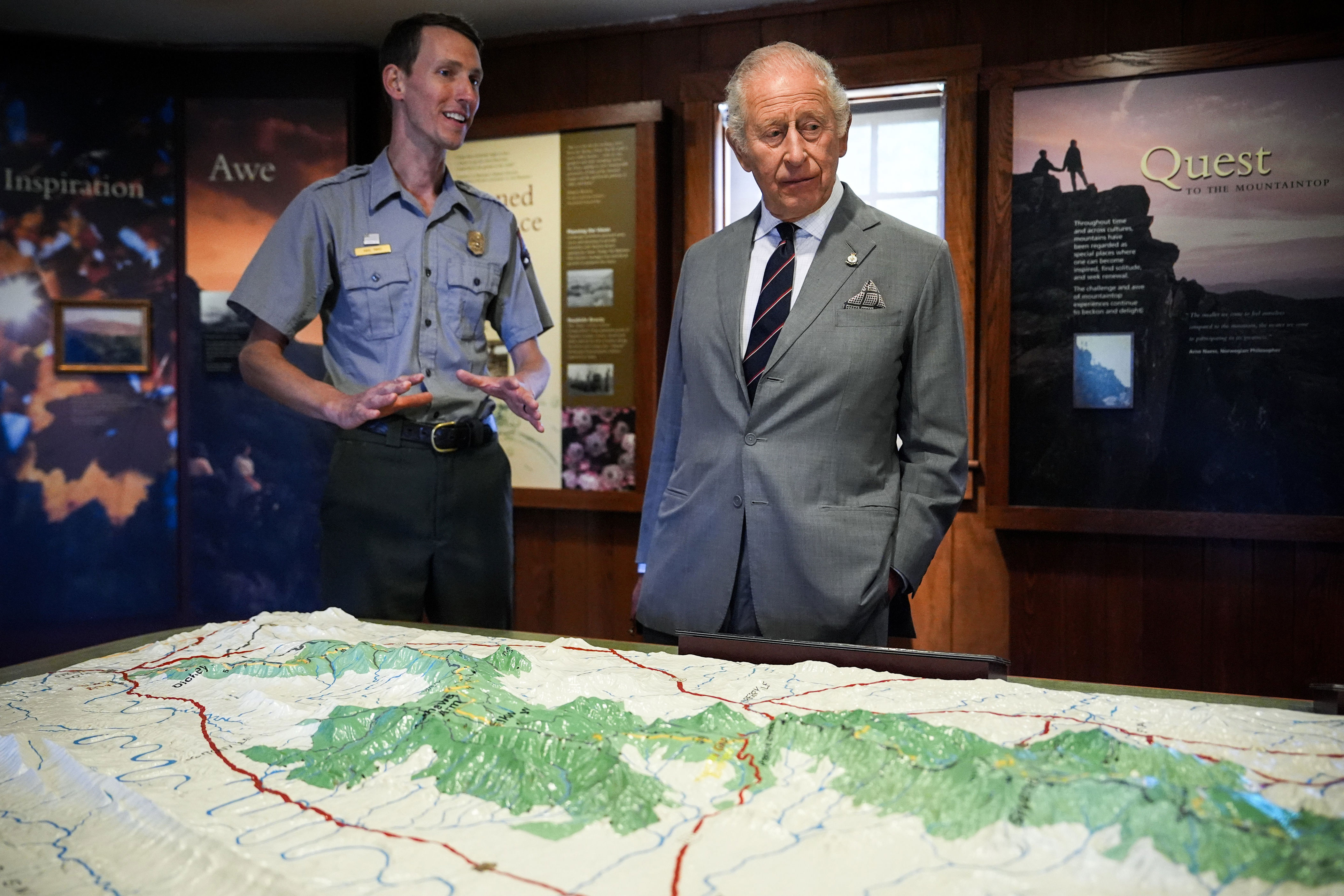 Interpretation park ranger Karl Rand, left, shows King Charles III, right, the topography of Shenandoah National Park inside Dickey Ridge Visitor Centre (Getty)
