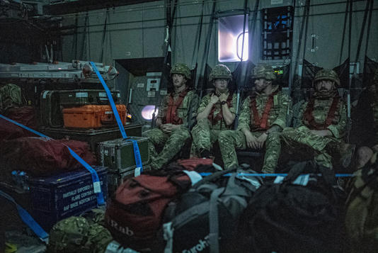 British Armed Forces prepare to land at a British military base in an undisclosed location in the Middle East, on 23 April (PA)