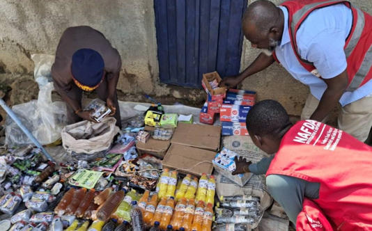 Officers from Nigeria’s National Agency for Food and Drug Administration and Control inspect medicines for sale at an open air market - X/@NafdacAgency