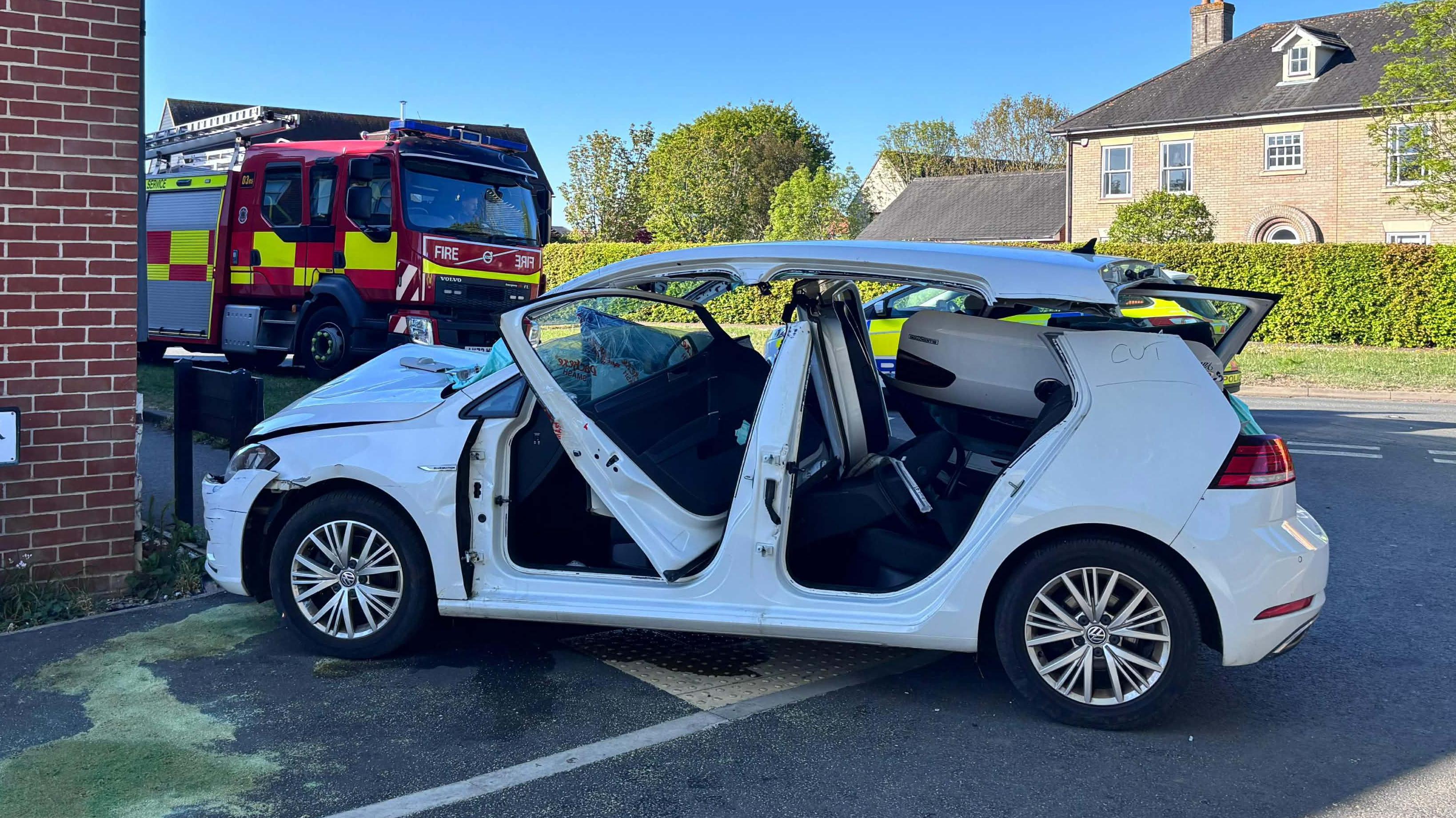 Car driver cut free after crashing into house