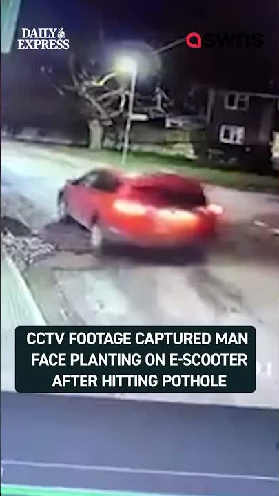 E-scooter rider wipes out after hitting pothole