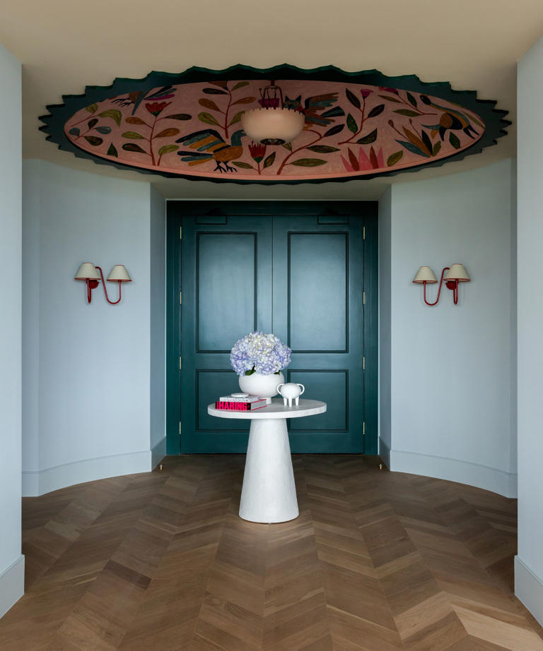 How a pale blue entryway creates a calm and dramatic first impression