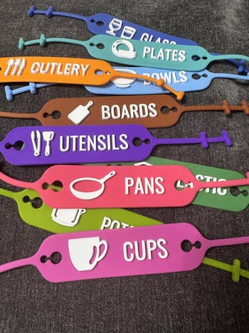 Colored kitchen labels for neatly organizing items like glassware, plates, cutlery, and more, with illustrative icons for easy identification