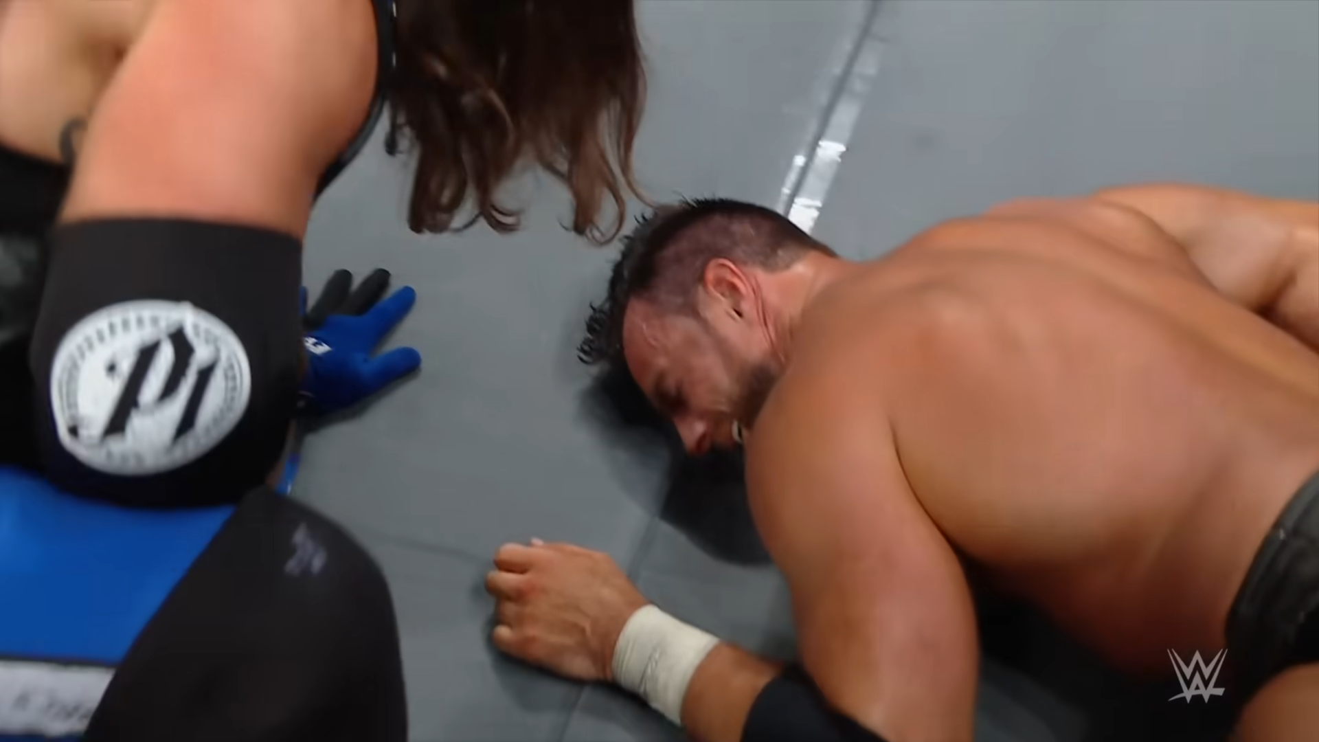 Wrestlers secretly communicating mid-match