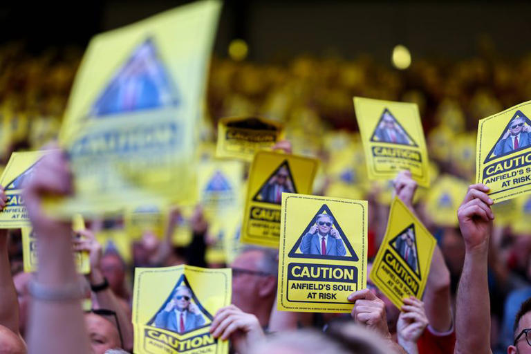 Fans held up cards in protest against the price increases