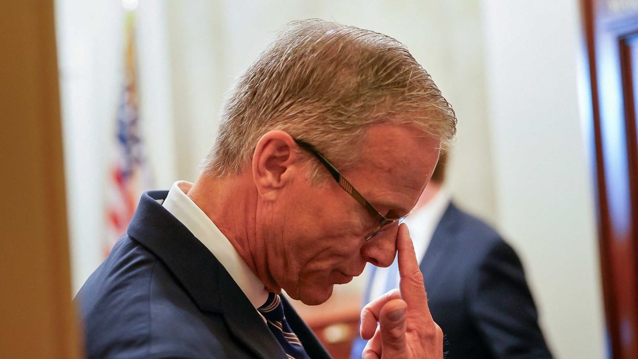 Senate Majority Leader John Thune pushes his glasses up as he speaks to reporters outside his office on Capitol Hill in Washington, D.C., October 14, 2025. REUTERS/Elizabeth Frantz