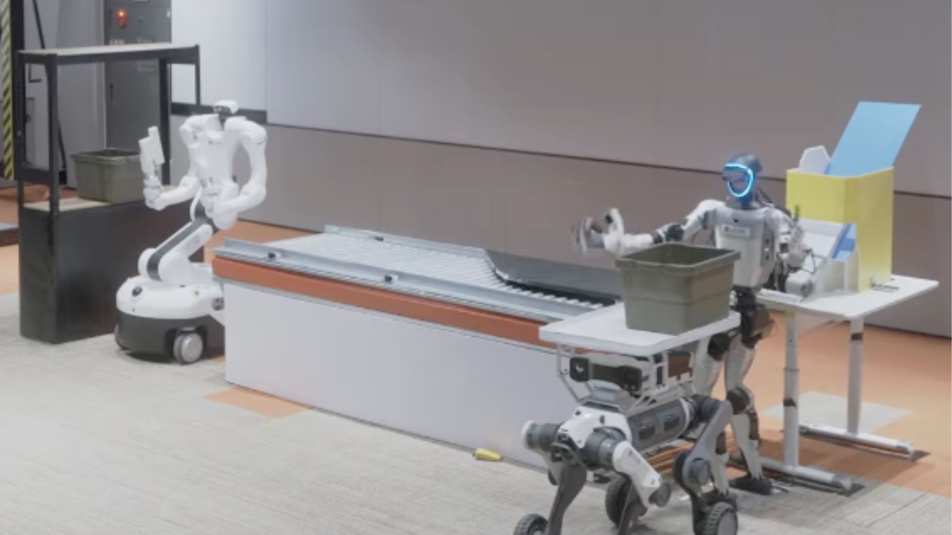 Watch humanoid and dog-like robots team up to handle warehouse work ...