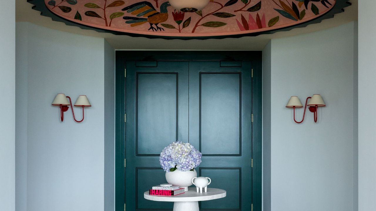 How a pale blue entryway creates a calm and dramatic first impression