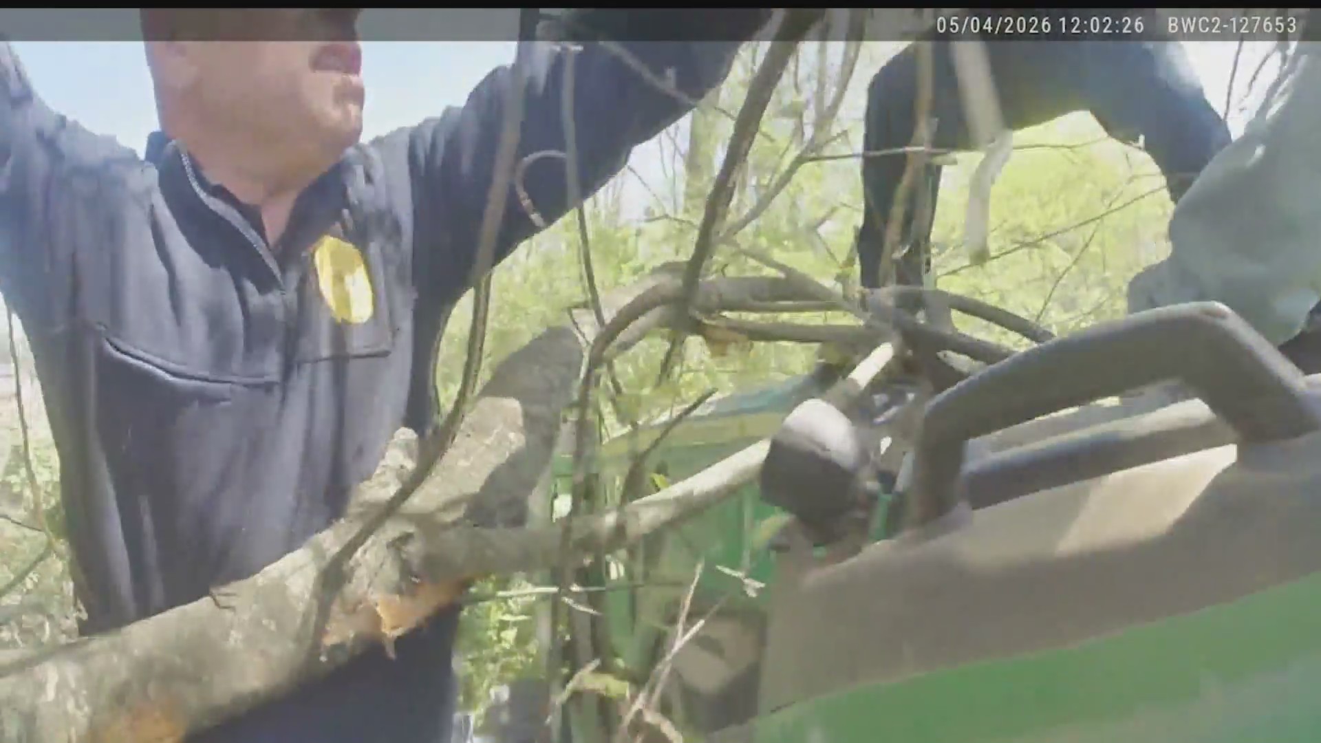 Emergency crews rescue man trapped under tree