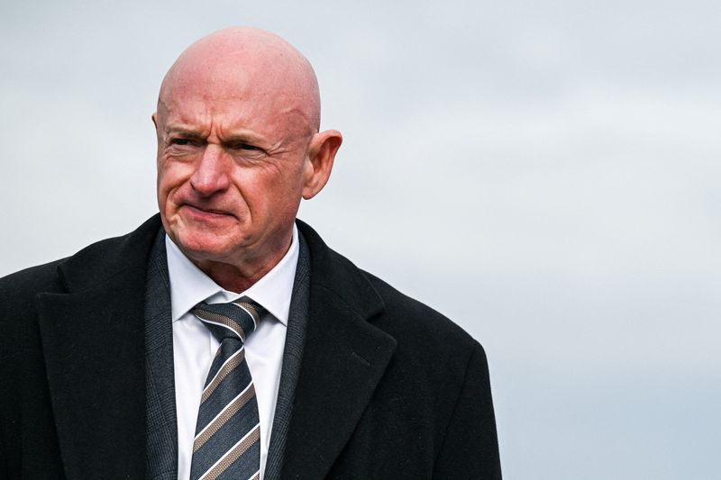 FILE PHOTO: U.S. Senator Mark Kelly (D-AZ) looks on at a press conference on Capitol Hill in Washington