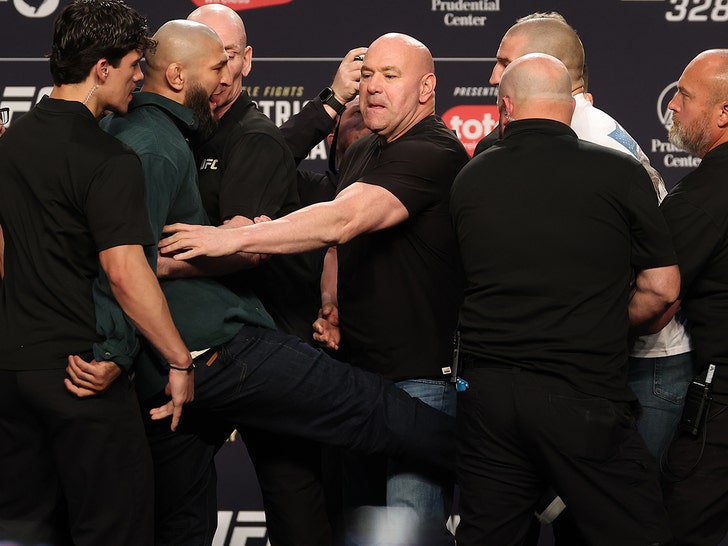 Khamzat Chimaev kicks Sean Strickland at UFC presser, armed security on ...