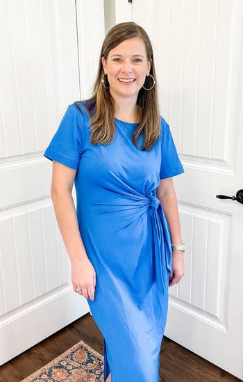 reviewer wearing the blue dress