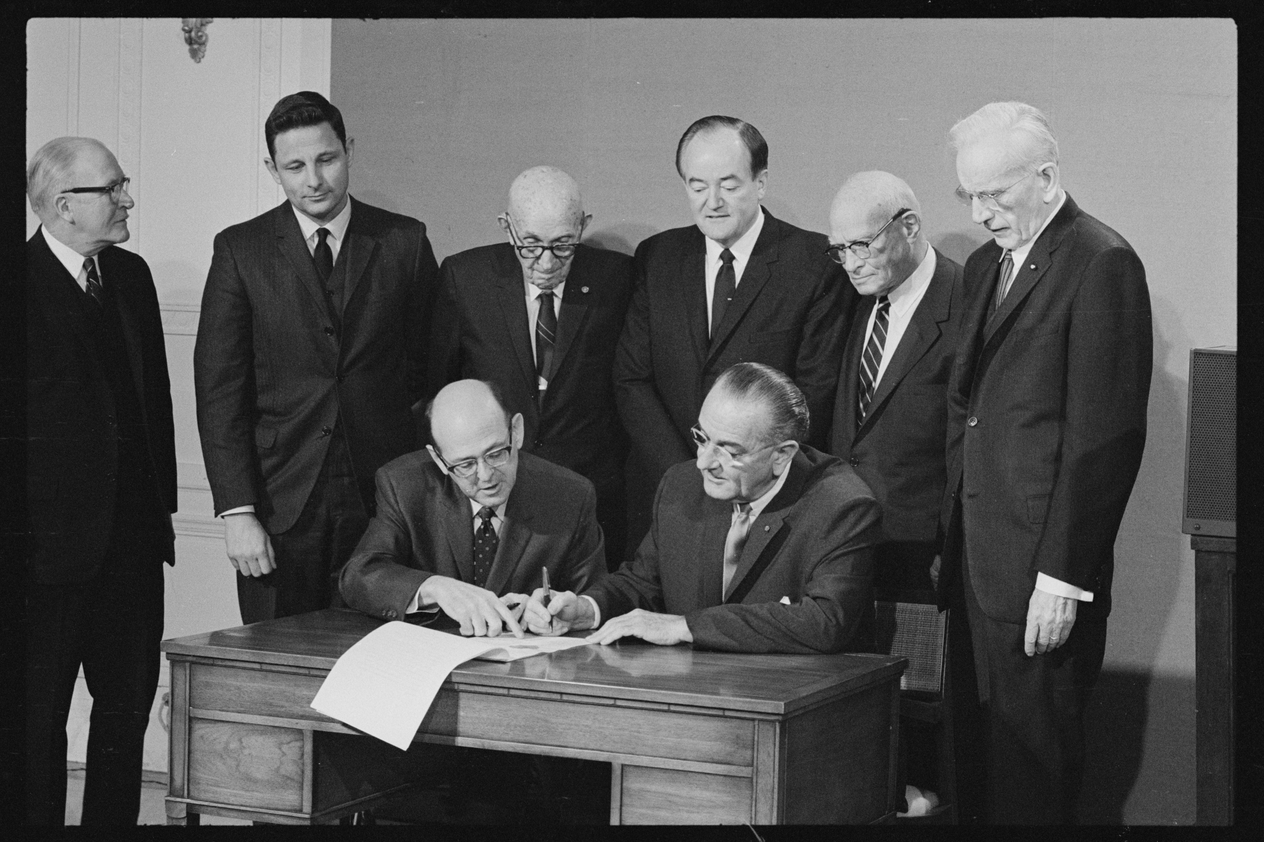 President Lyndon B. Johnson signs the 25th Amendment to the U.S. Constitution at the White House in Washington, on Feb. 23, 1967.