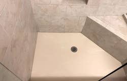 after image of the same shower completely clean