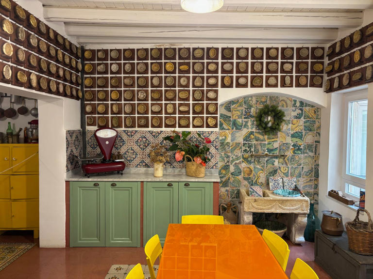 a vibrant kitchen with decorative elements and functional furniture