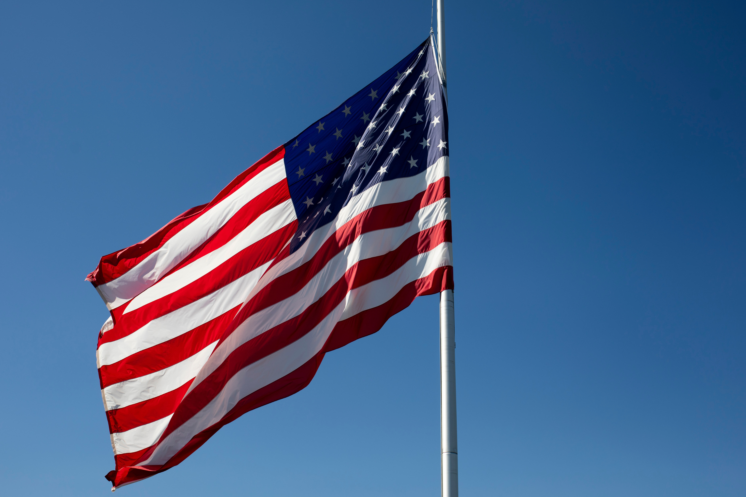 File image: A flag flies at half staff following a shooting and fire at the Church of Jesus Christ of Latter-day Saints Michigan, on September 30, 2025 in Grand Blanc, Michigan.