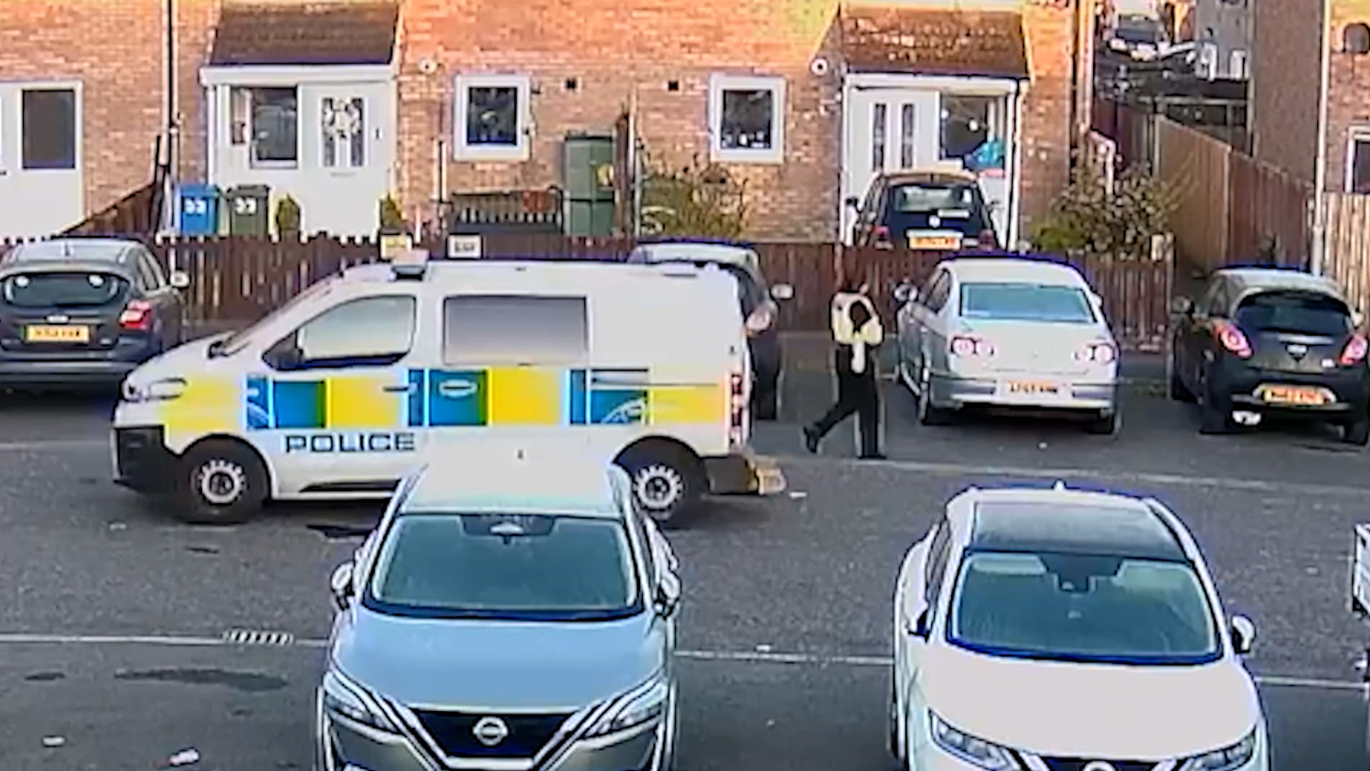 Moment police van rolls away after handbrake left off