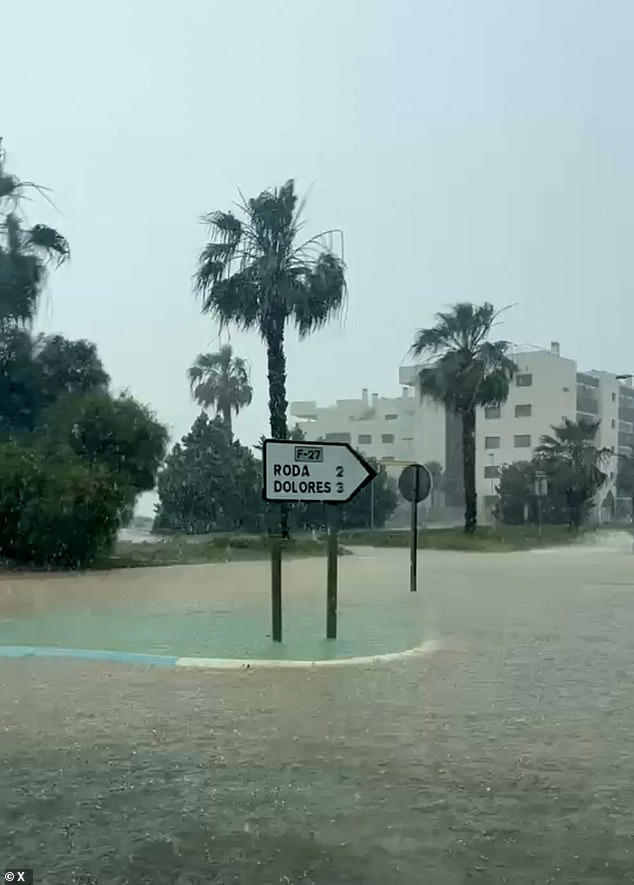 Roads become rivers in southern Spain as freak storms hit holiday hotspots