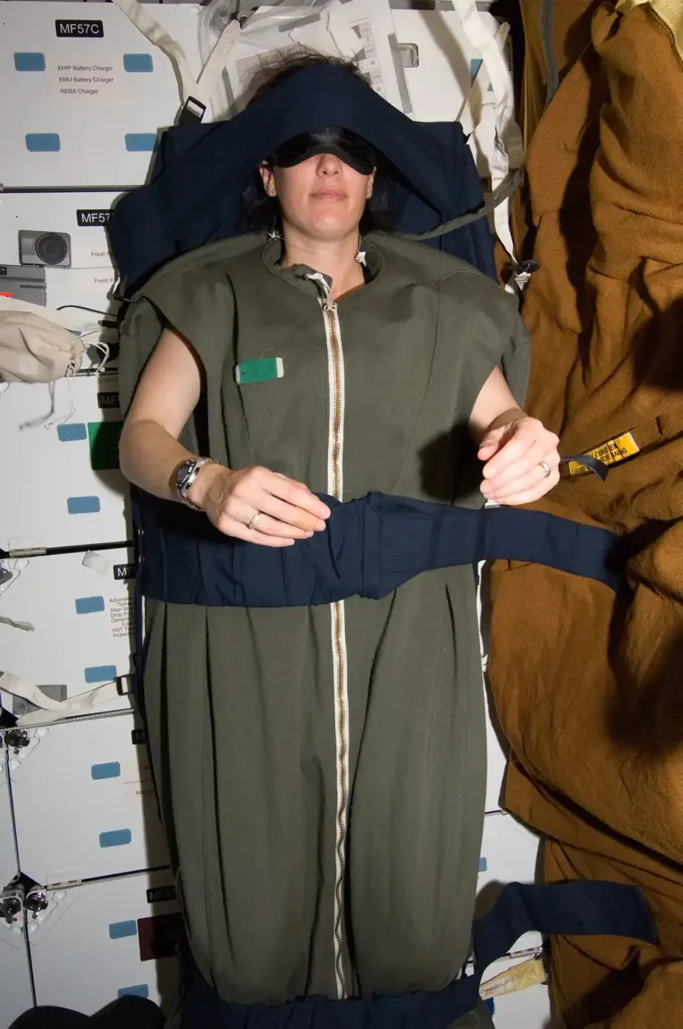 The hidden reason astronauts sleep tethered to the wall - and what ...
