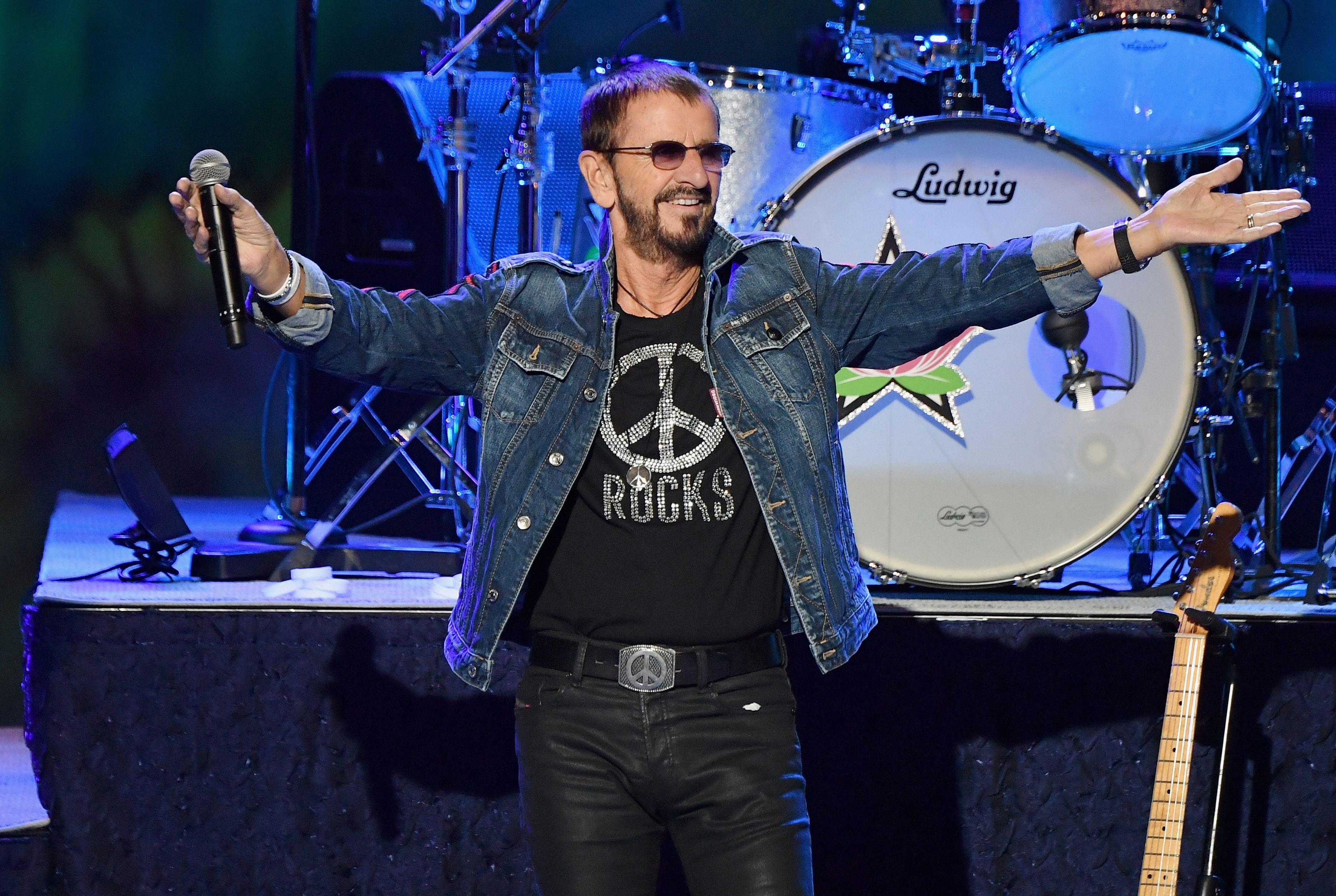 English musician Ringo Starr performs onstage at the 50th anniversary celebration of Woodstock at Bethel Woods Center for the Arts on August 15, 2019 in Bethel, New York. (Photo by Angela Weiss / AFP) / RESTRICTED TO EDITORIAL USE (Photo credit should read ANGELA WEISS/AFP via Getty Images)