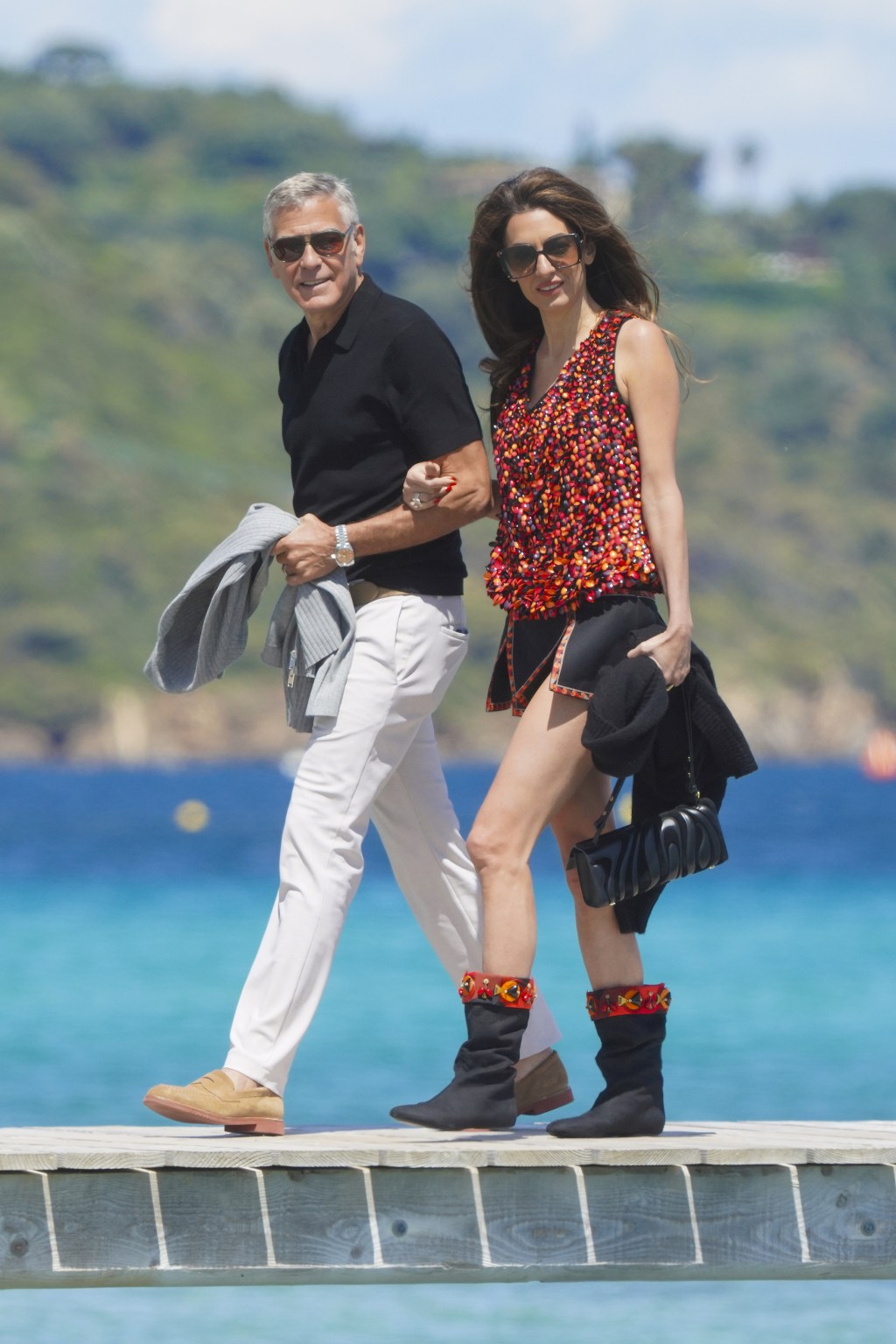 Amal Clooney celebrates George's 65th birthday in daring top and high-slit  miniskirt