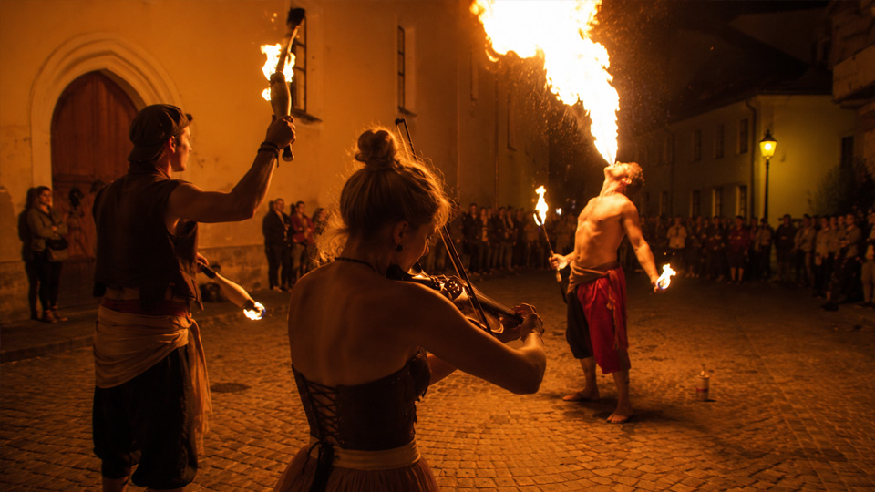 Circus performance combines fire tricks and aerial movement