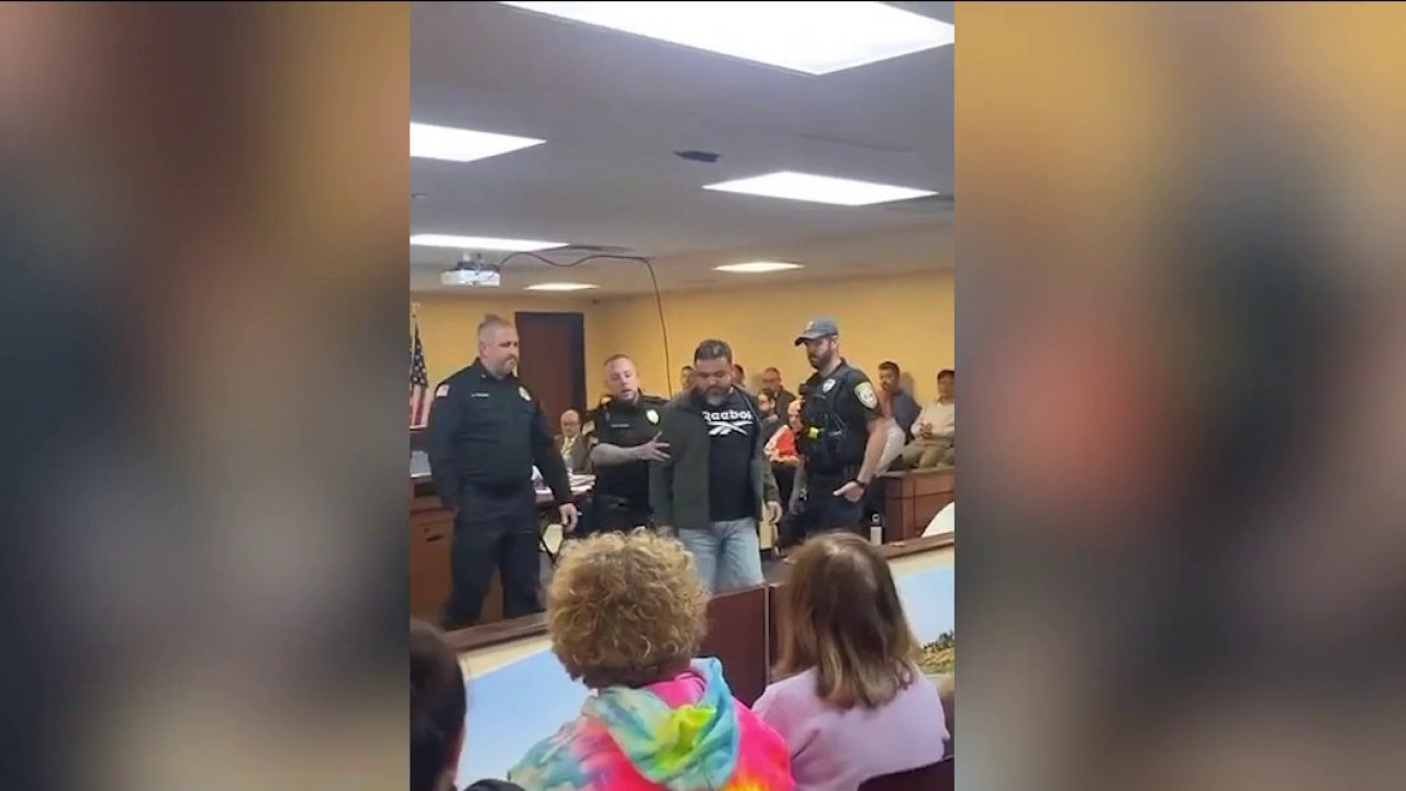 Man ejected, arrested at public meeting about Indiana data centers