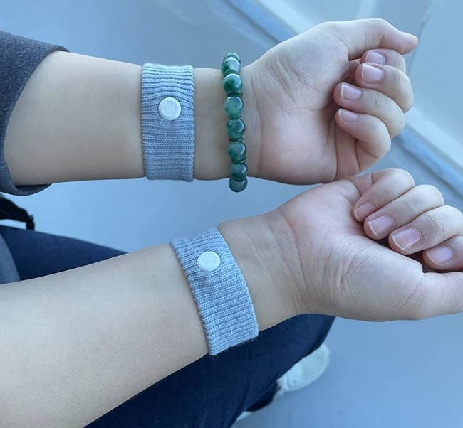 Reviewer's photo of them wearing two Sea Bands, one on each wrist