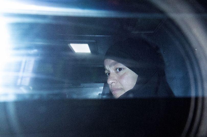 Zeinab Ahmad, one of two women linked to alleged Islamic State jihadists, is seen being taken away in an armoured police vehicle outside the Melbourne Magistrates' Court in Melbourne on May 8, 2026